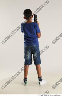 TIMBO STANDING POSE WITH GUN